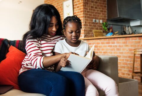 african-mother-helping-her-daughter-in-doing-her-homework